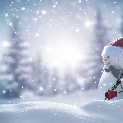 Merry christmas and happy new year greeting card with copy-space.Happy snowman standing in christmas landscape.Snow background.Winter fairytale.